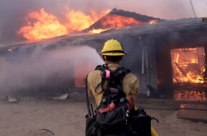 A California wildfire, driven by strong winds, has expanded to more than 14,000 acres, prompting evacuation orders