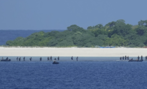 Philippine forces recapture an island in a mock combat as China’s navy watches