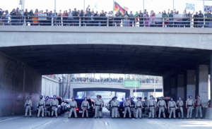 Marchers protesting planned deportations block major freeway in Los Angeles