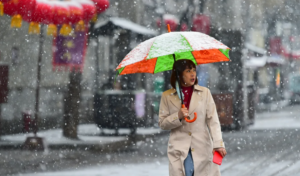 A weekend of fire and ice: China’s east hit by snow blizzards and record heat