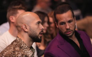 Andrew Tate, social media influencer who faces trafficking charges, sits cageside for UFC 313