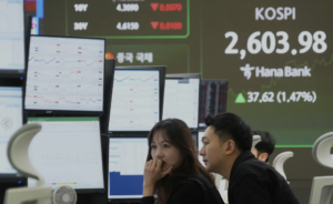 Asian shares trim gains after Trump vows to push ahead with more tariff hikes on April 2