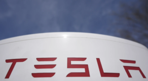 Man drives car into protesters outside a Tesla dealership, nobody hurt, sheriff says
