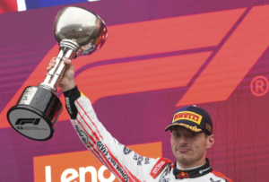 Red Bull’s Max Verstappen holds off McLarens to win his fourth straight Japanese GP