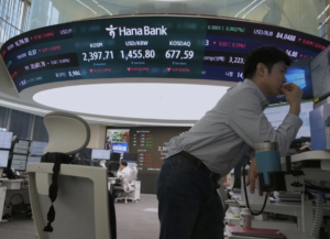 Global shares wobble as US-China trade war escalates