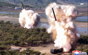 North Korea says leader Kim supervised missile tests simulating nuclear strikes against rivals